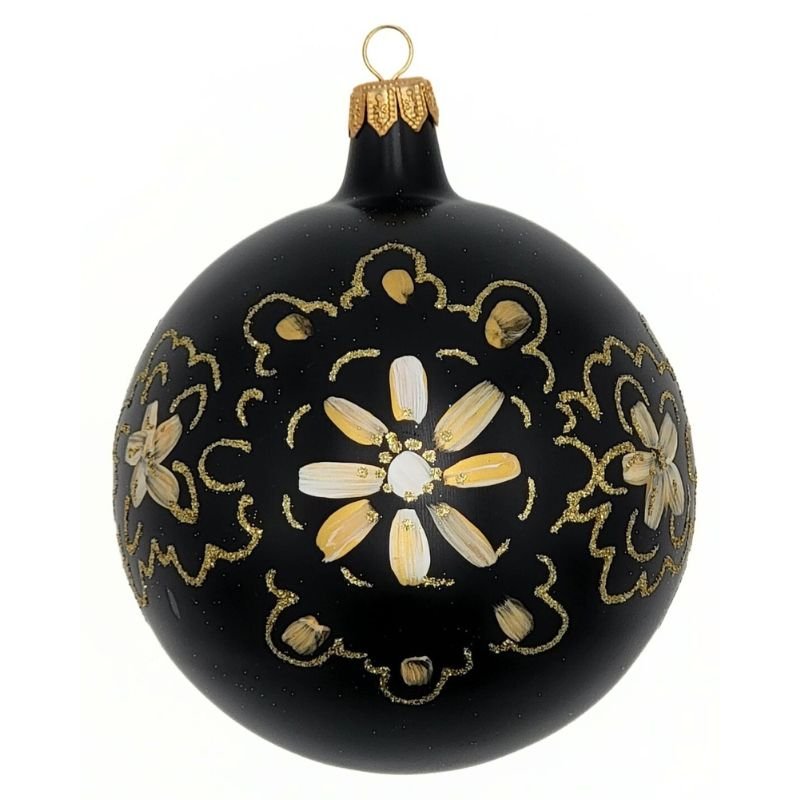 Blown glass ball ornament in matte black with a gold floral design hand painted on it