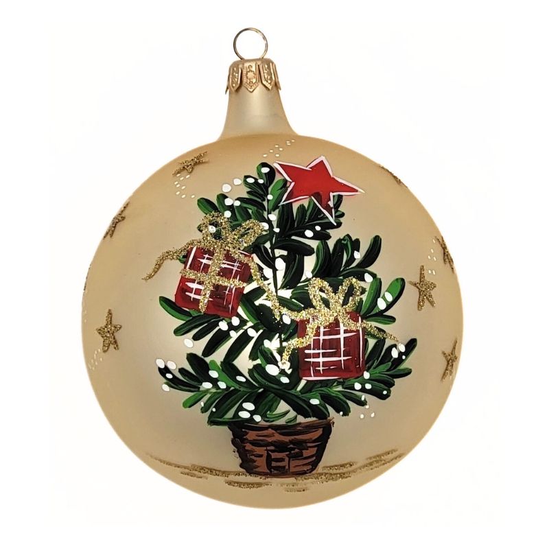 Blown glass ball ornament in matte gold with a Christmas tree with presents hand painted on it