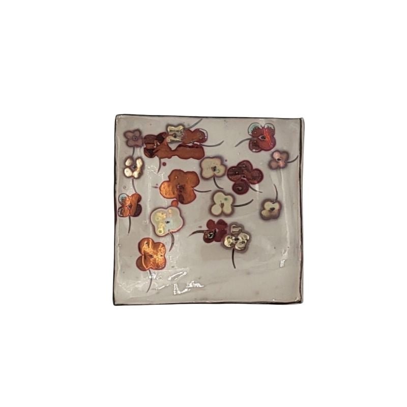 "Hand-painted trinket dish with allover floral design in shimmering iridescent tones, perfect for holding jewelry or small items"