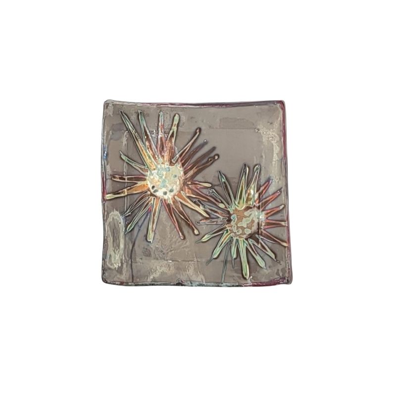 "Hand-painted trinket dish with iridescent sunburst design, perfect for holding jewelry or keys"