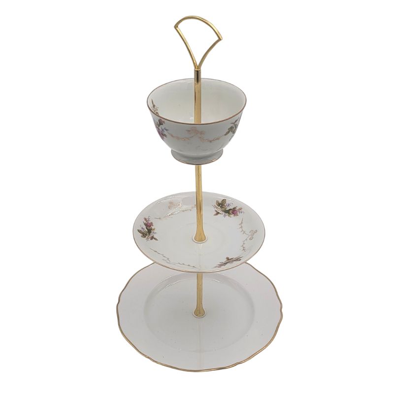 3 tiered server made of a vintage salad plate, china cup and saucer with gold hardware.