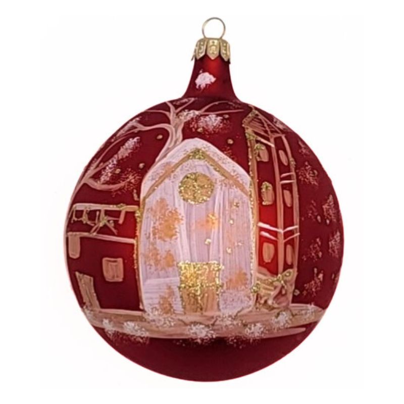 Blown glass ball ornament in matte red with a white and gold church hand painted on it