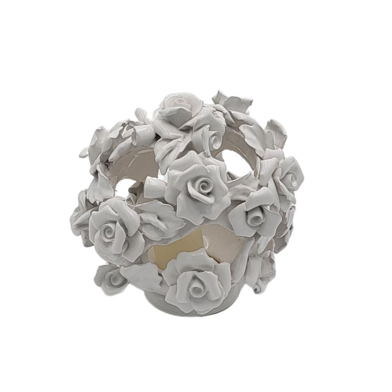 White ceramic candleholder in a sphere shape covered in small roses..