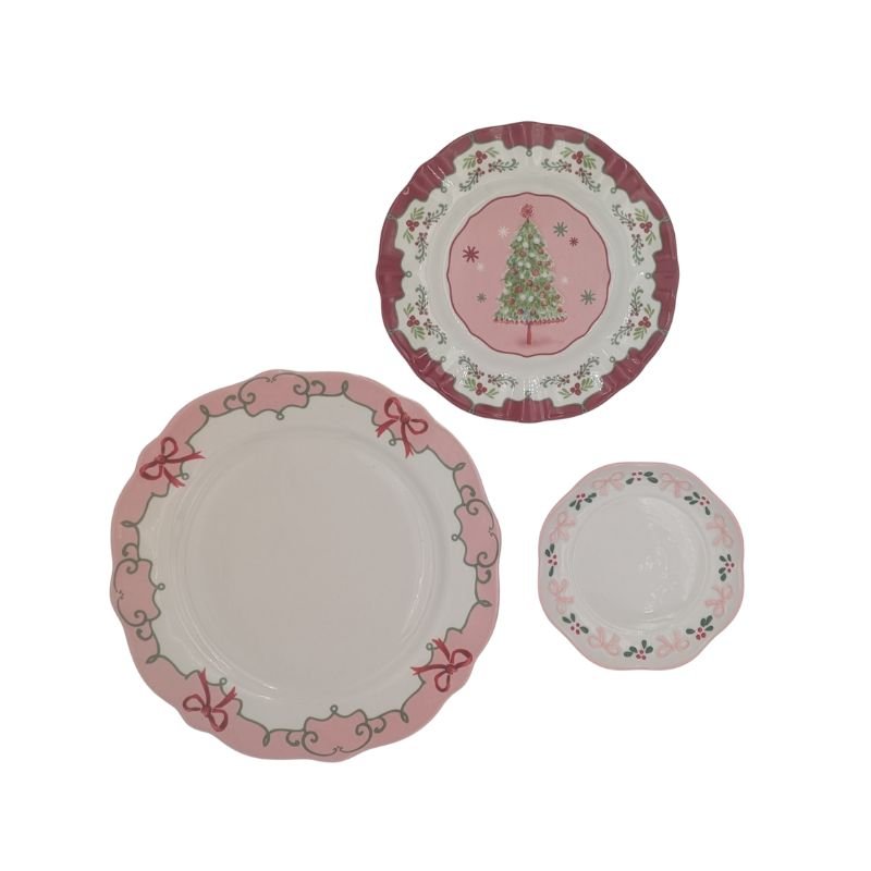 Three-tiered pink Christmas plate server with gold handle featuring holly, ribbon, and Christmas tree designs by Ardsley Barrett
