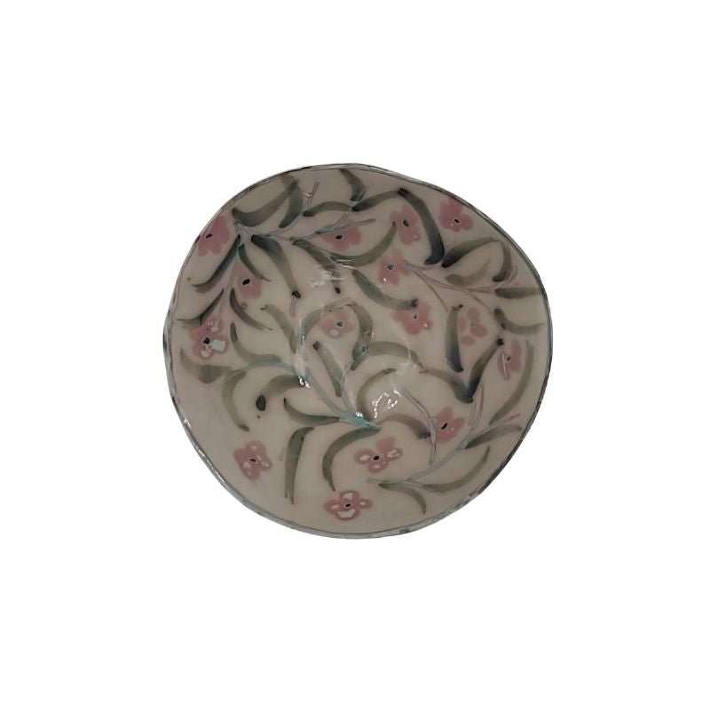 "Hand-painted iridescent bowl with small floral pattern, perfect for holding small items or as a decorative accent"