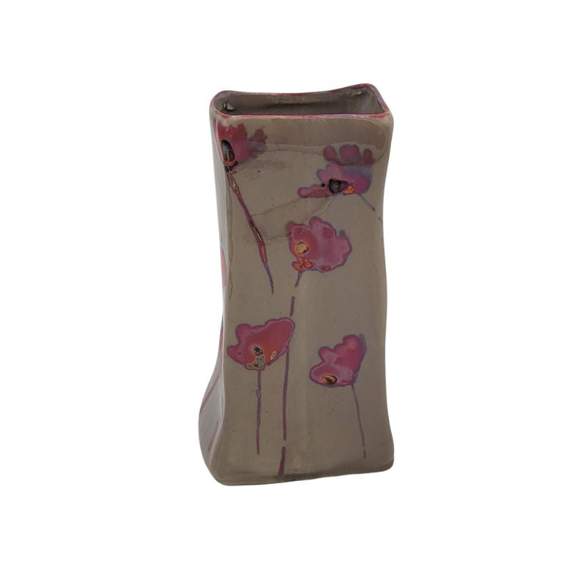 Rectangular vase with iridescent pink poppies.