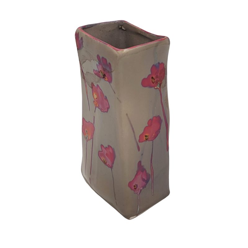 Rectangular vase with iridescent pink poppies.