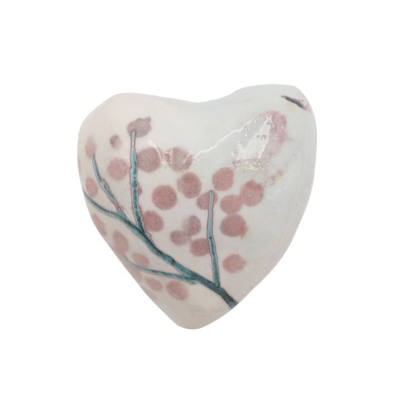 Handcrafted ceramic heart with blush cherry blossom design and teal branches, finished with an iridescent glaze.
