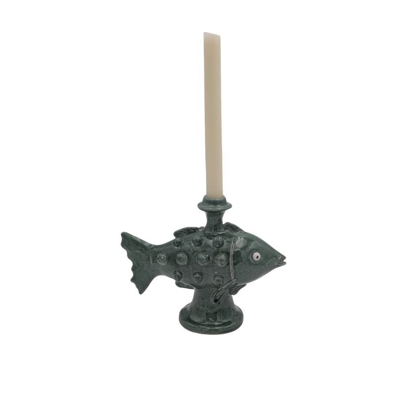 Handcrafted ceramic fish candle holder in deep green glaze, designed for taper candles.
