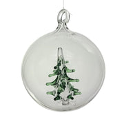 Hand blown glass ball ornament in clear glass with a small green Christmas tree blown inside the ball