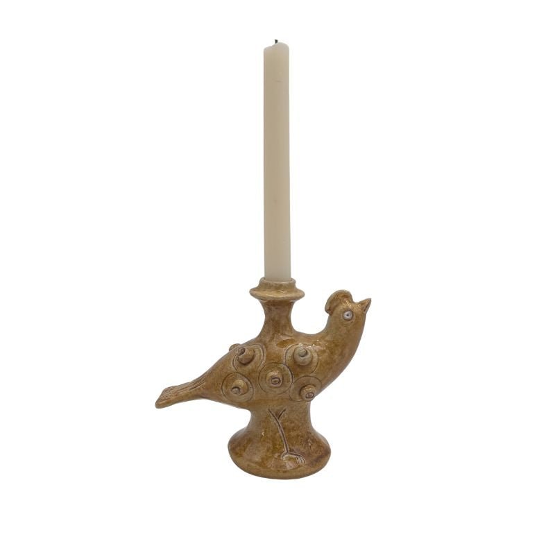 Handcrafted ceramic pheasant candle holder with golden glaze, designed to hold a taper candle.