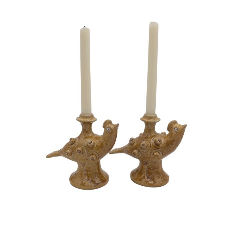 Handcrafted ceramic pheasant candle holder with golden glaze, designed to hold a taper candle.