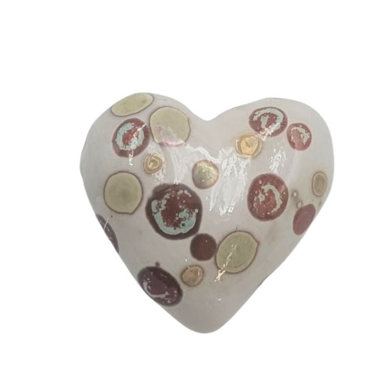 Handcrafted ceramic heart with soft coral floral pattern and iridescent glaze detailing.