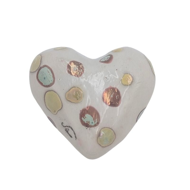 Ceramic heart with pastel gold, blush, and mint polka-dot design and iridescent glaze by Paola Staccioli.