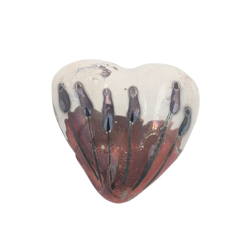 Paolo Staccioli is a ceramic artist from Florence Italy known for her luster glaze painting technique which adds an iridescent touch to her whimsical pieces.  