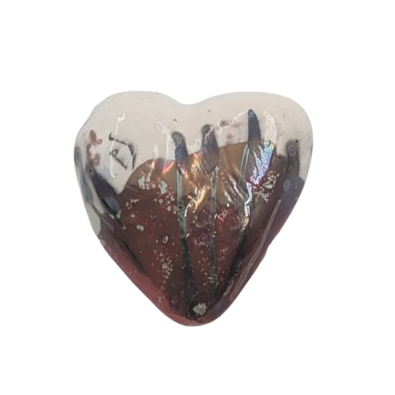 Paolo Staccioli is a ceramic artist from Florence Italy known for her luster glaze painting technique which adds an iridescent touch to her whimsical pieces.  