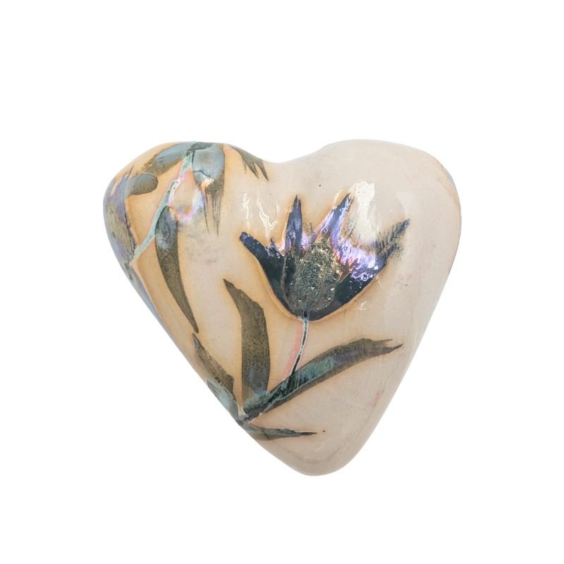 Handcrafted ceramic heart with soft green and purple floral design and iridescent glaze, one-of-a-kind decorative art piece.