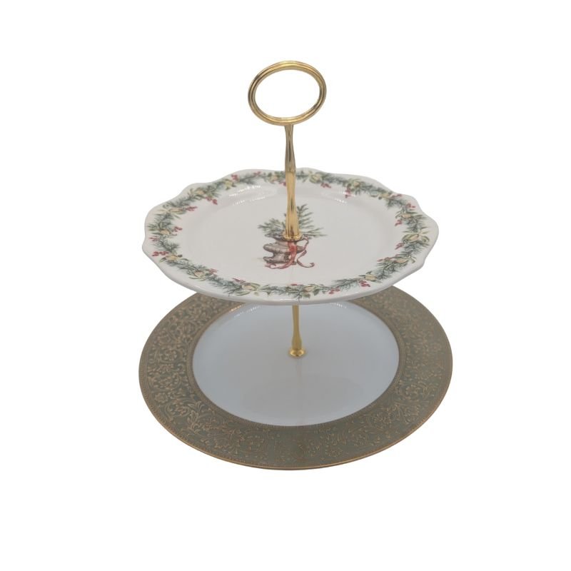 Two-tiered vintage china server made from gold filigree and Christmas garland plates with gold handle, perfect for holiday entertaining