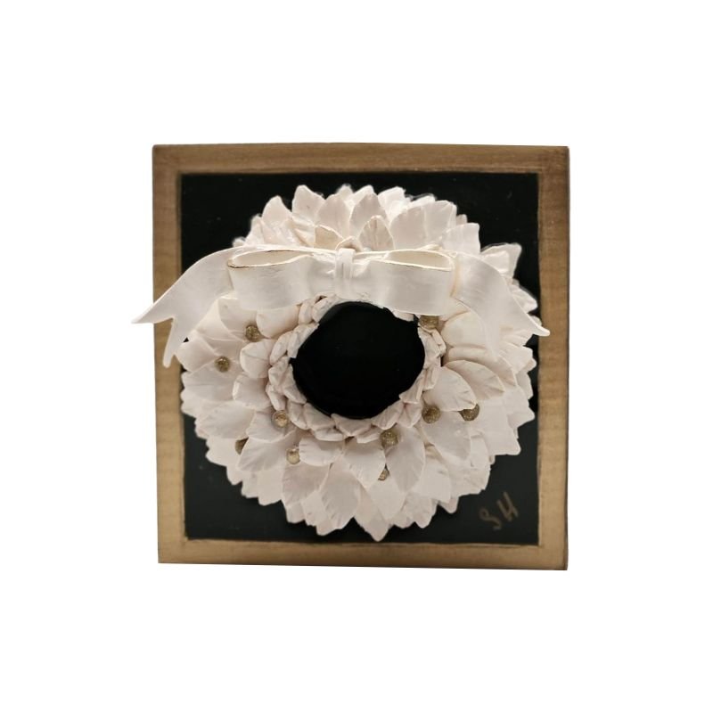 Handcrafted white wreath with white bow sealed in resin on a black-painted hardwood base, wall-hanging hardware included.