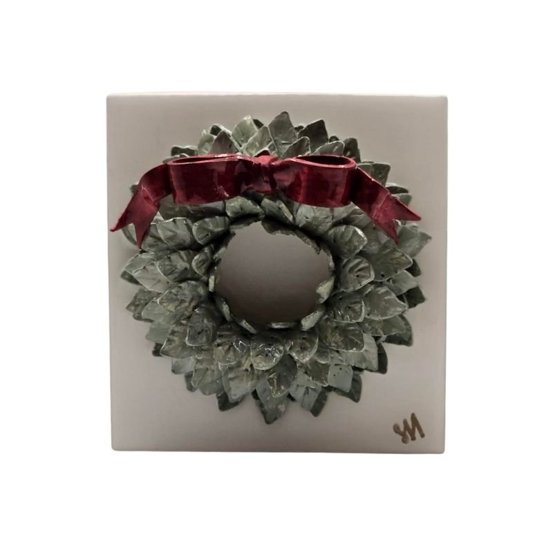 Handcrafted green wreath with red bow sealed in resin on a white-painted hardwood base, wall-hanging hardware included.