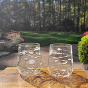 Set of two hand blown stemless wine glasses with a delicate white pattern