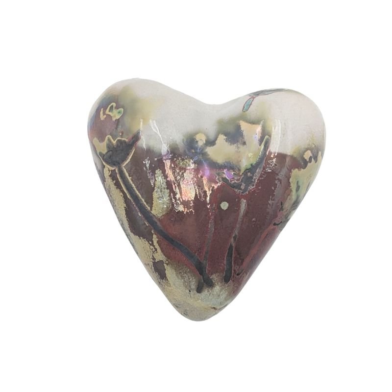 Handcrafted ceramic heart with earthy floral design in gold, taupe, and plum tones, finished with an iridescent glaze.