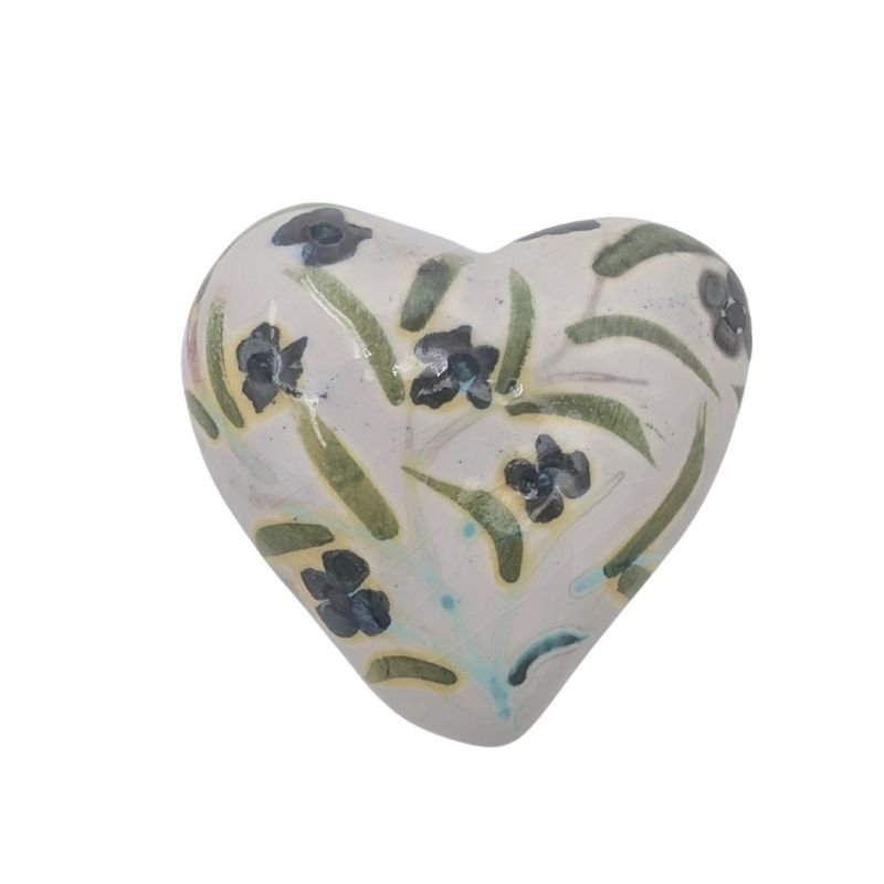 Ceramic heart with blue floral and green leaf design finished with an iridescent glaze by Paola Staccioli.