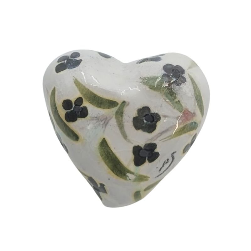 Ceramic heart with blue floral and green leaf design finished with an iridescent glaze by Paola Staccioli.