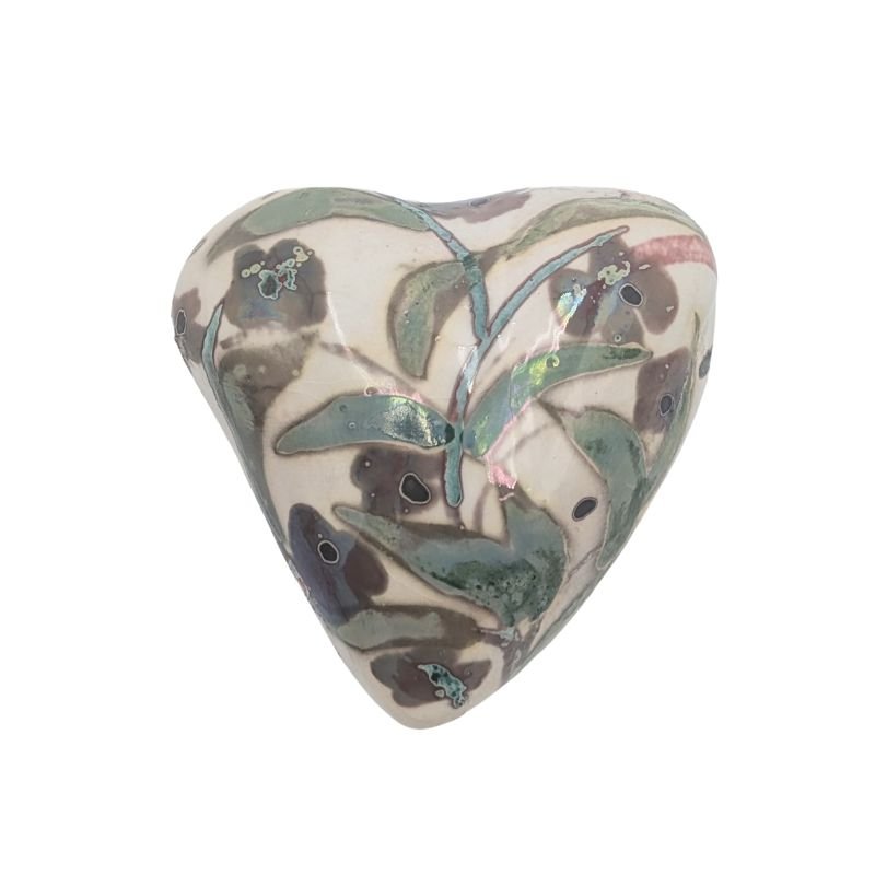 Handcrafted ceramic heart with soft green and plum leaf and blossom design, finished with a subtle iridescent glaze.