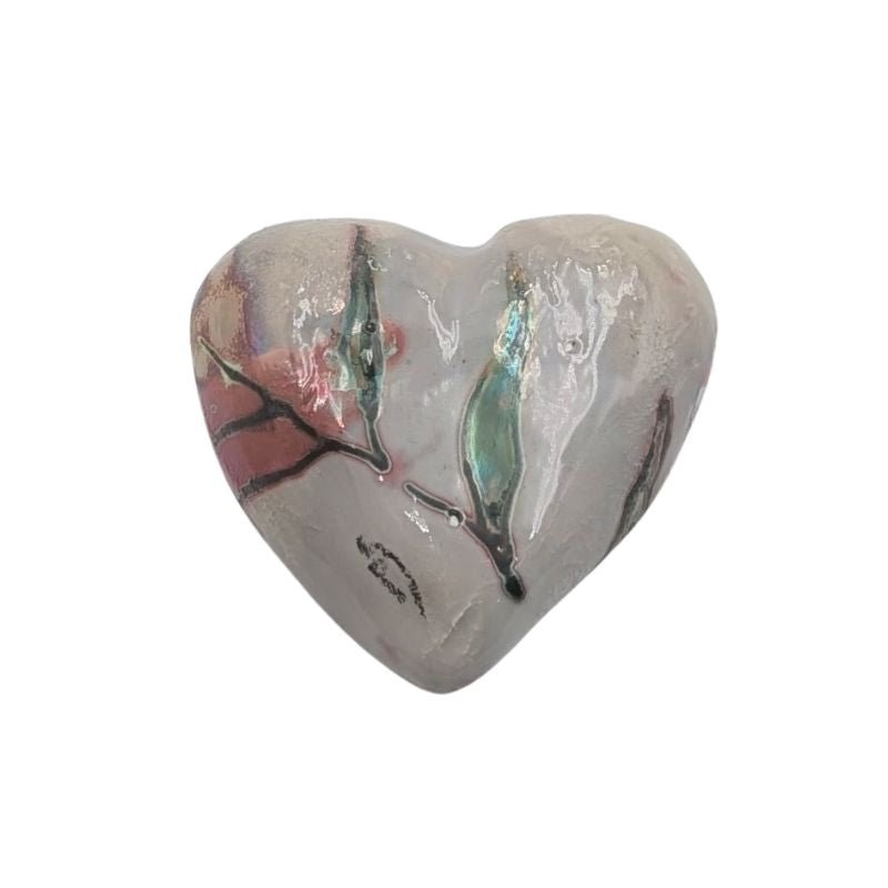 Handcrafted ceramic heart with soft coral floral pattern and iridescent glaze detailing.