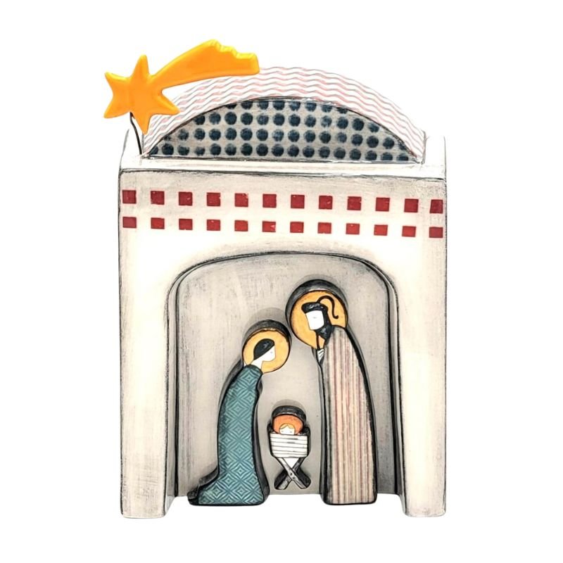 Ceramic nativity showing Mary, Joseph and baby Jesus with a gold star on top