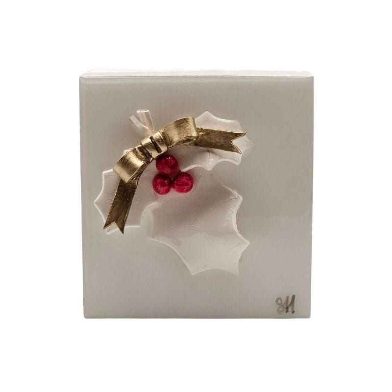 Handcrafted white holly leaf with red berries and white bow sealed in resin on a white-painted hardwood base.
