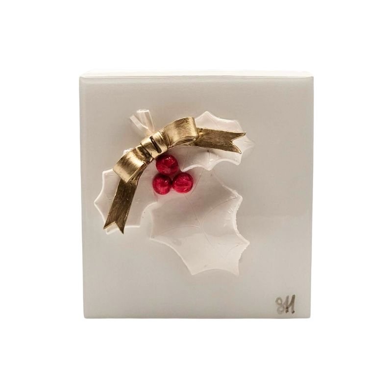 Handcrafted white holly leaf with red berries and white bow sealed in resin on a white-painted hardwood base.