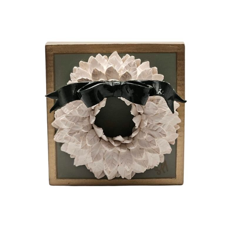 Handcrafted white wreath with green bow sealed in resin on a white-painted hardwood base green, wall-hanging hardware included.